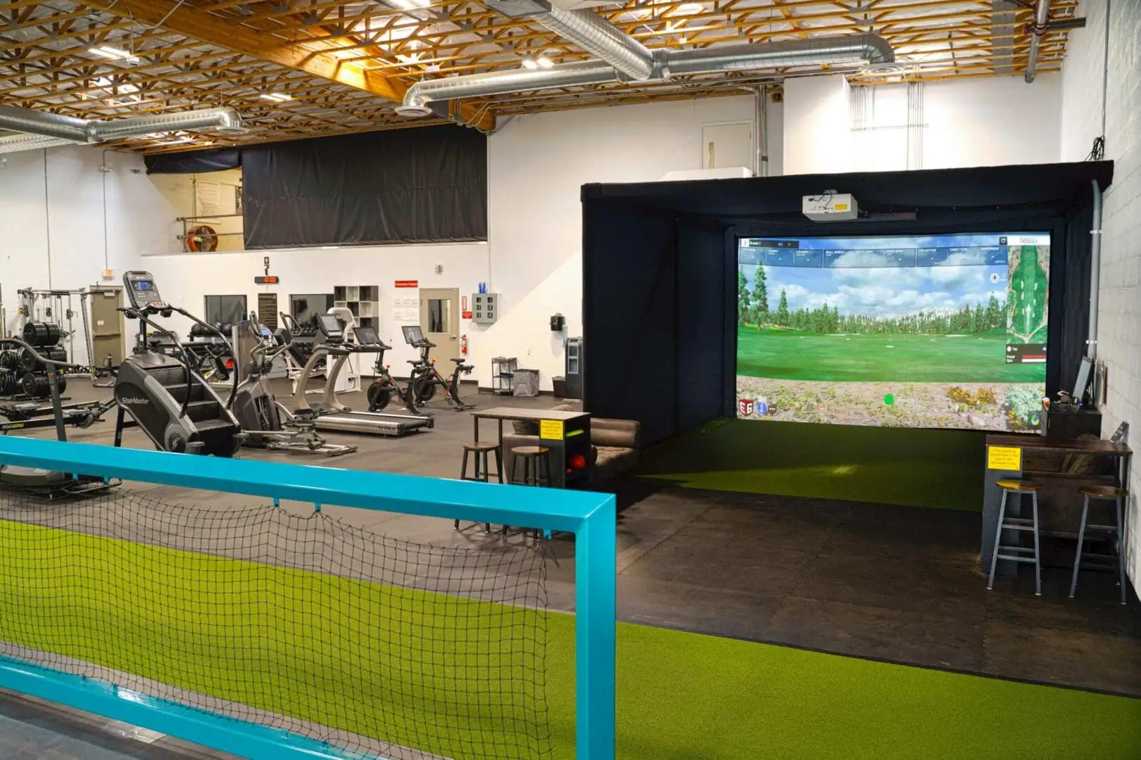 Commercial golf simulator installation in a fitness facility