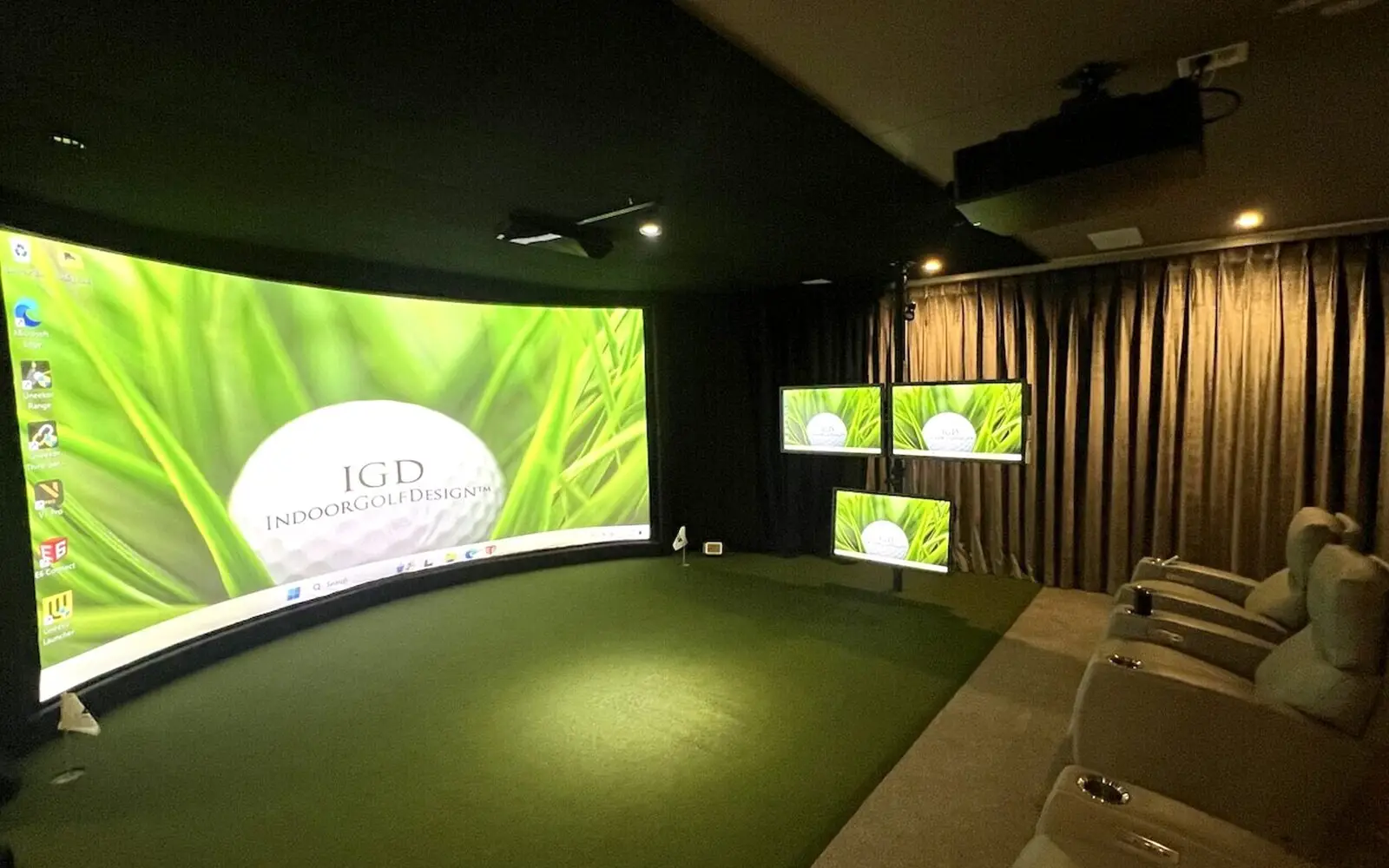 Home theater golf simulator with curved screen and theater seating